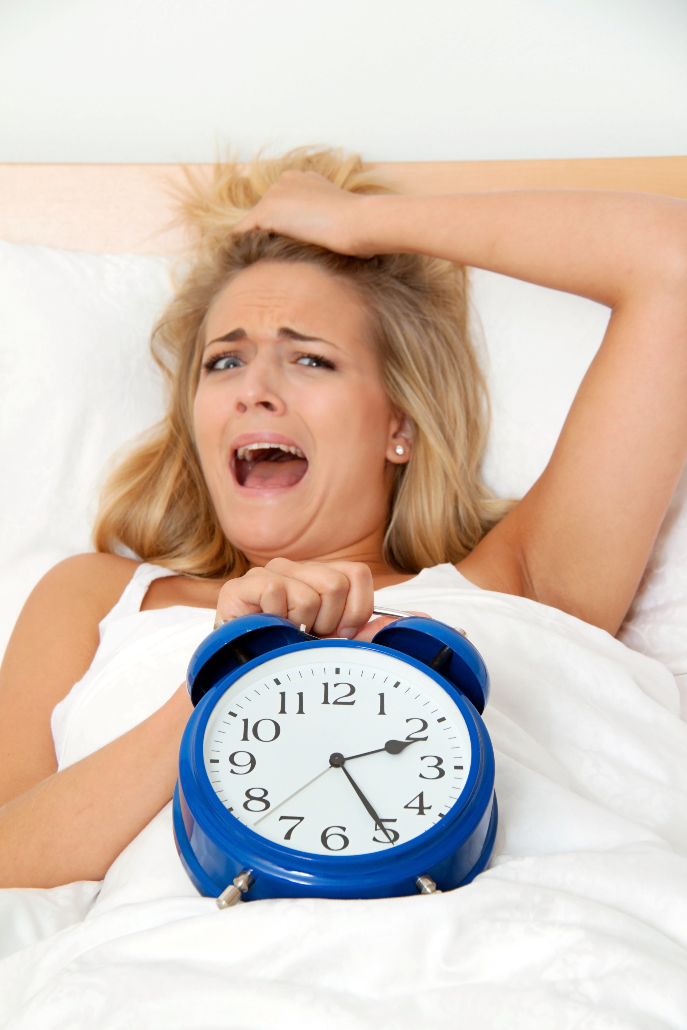 girl with insomnia and clock Sleep and Attention Deficit Disorders