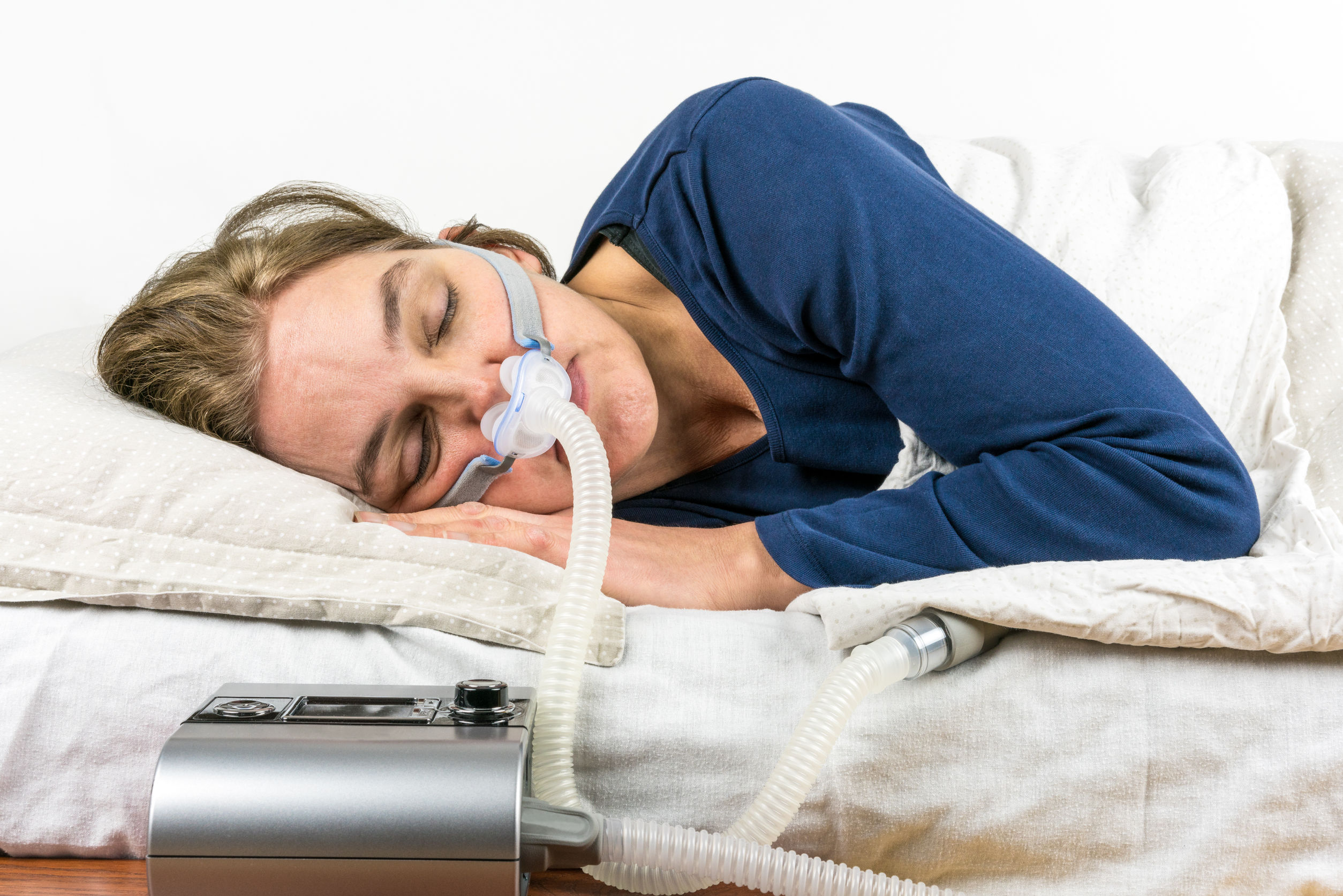 Woman with sleep apnea on CPAP Sleep and Attention Deficit Disorders